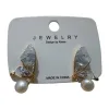 Golden butterfly-shaped stud earrings are inlaid with transparent crystals and pearls and come with white labels Item Picture
